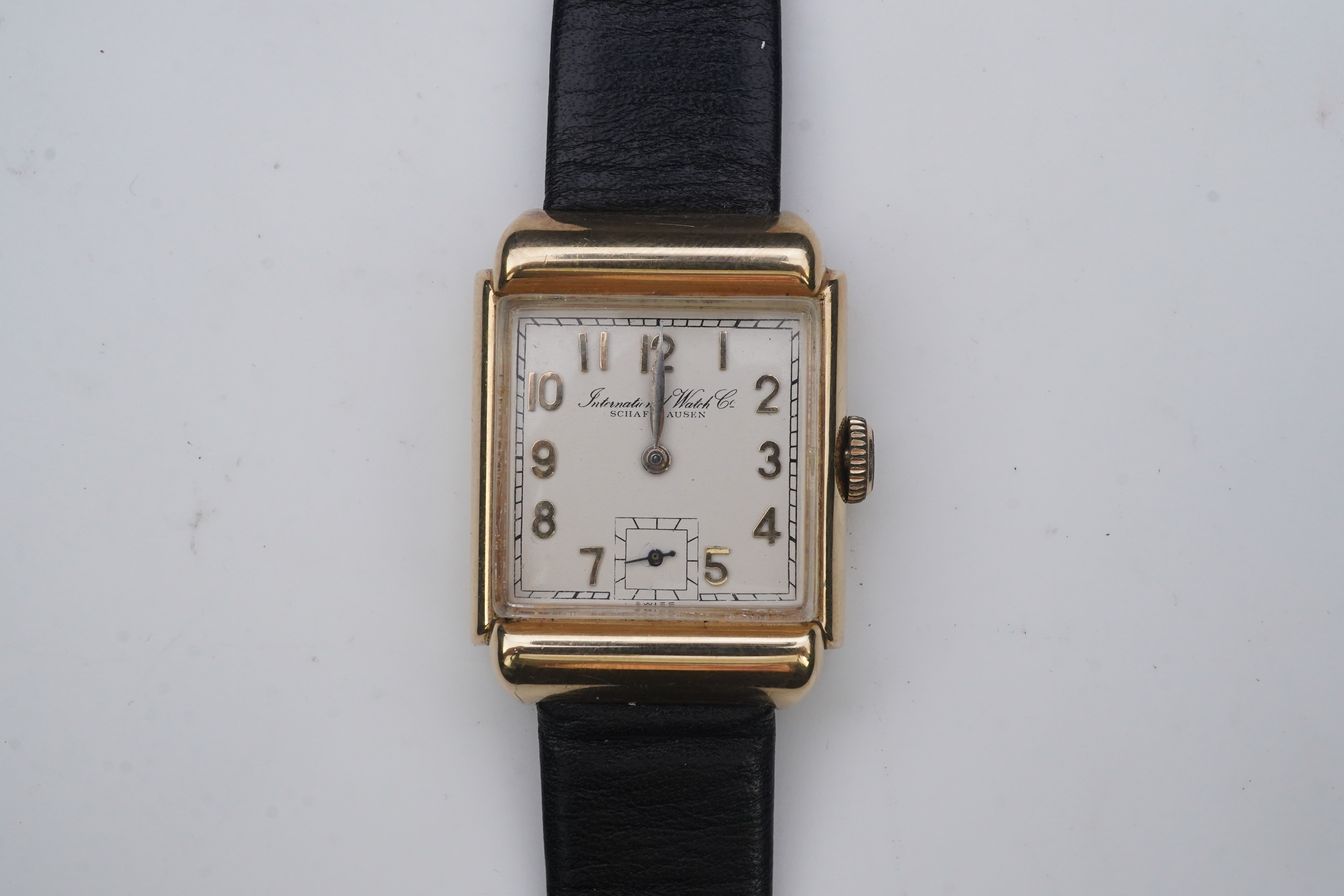 A gentleman's mid 20th century 14k gold International Watch Company manual wind wrist watch, on a later associated leather strap